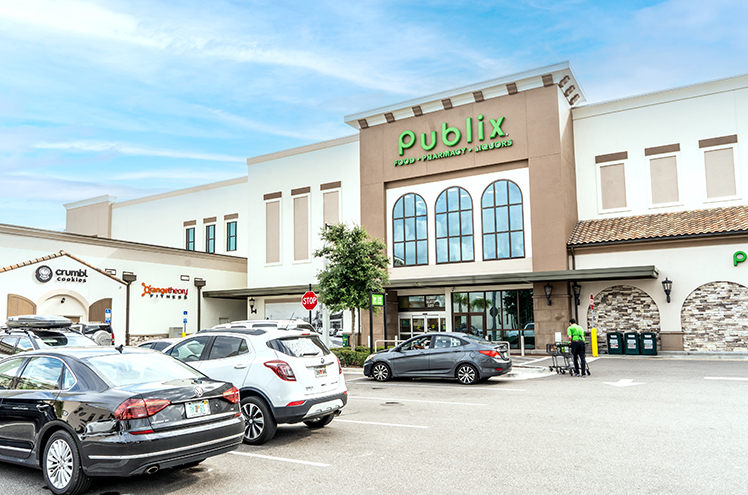 The Publix Supermarket Anchor for East San Marco, showing a bustling parking lot and the facade of the store.