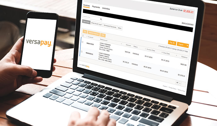 Tenant paying rent online using VersaPay on their phone and laptop
