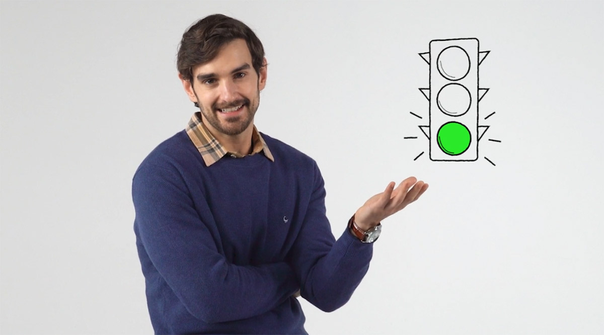 Image of The Whitebox host standing in front of a gray backgound.