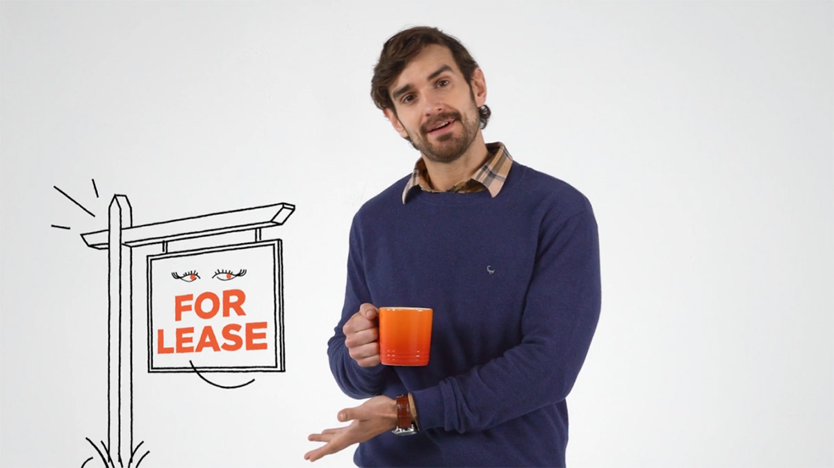 Image of The Whitebox host standing in front of a gray backgound.