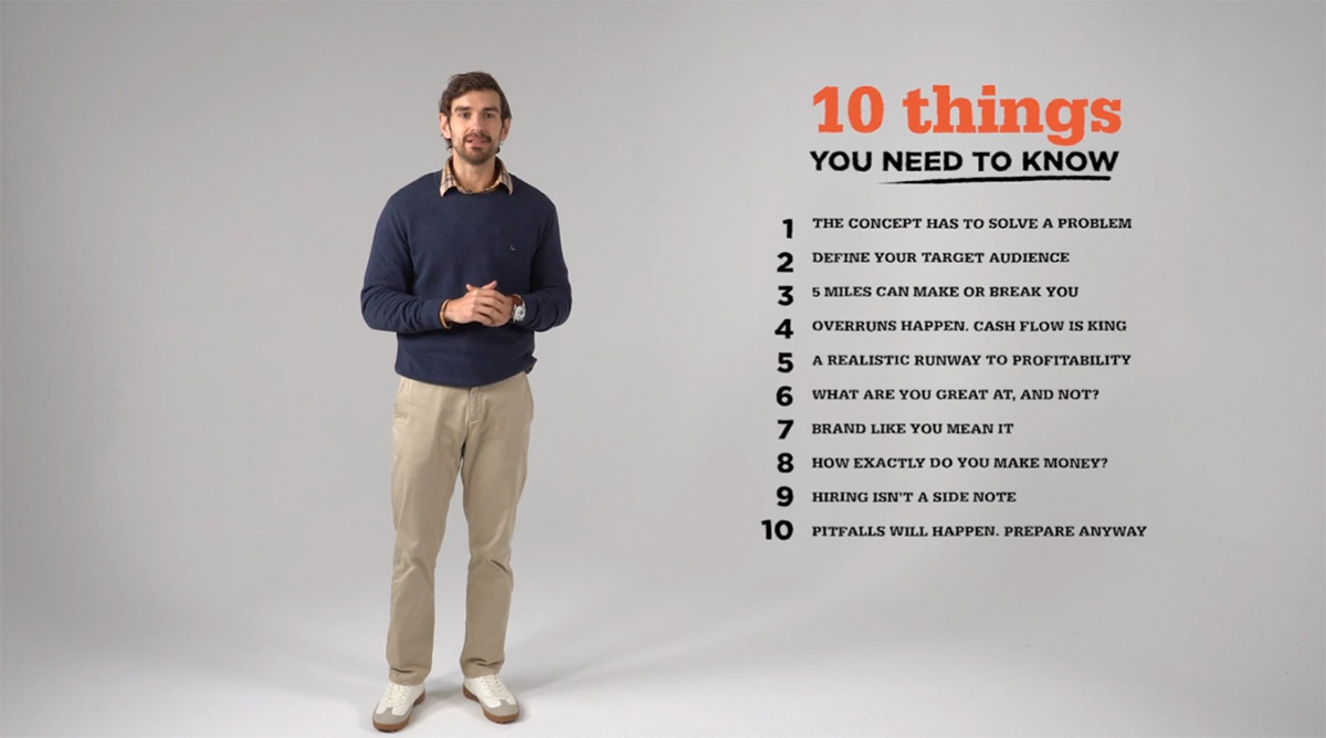 Image of The Whitebox host standing in front of a gray backgound.