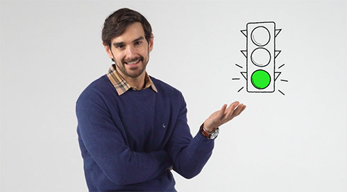 Image of The Whitebox host standing in front of a gray backgound.